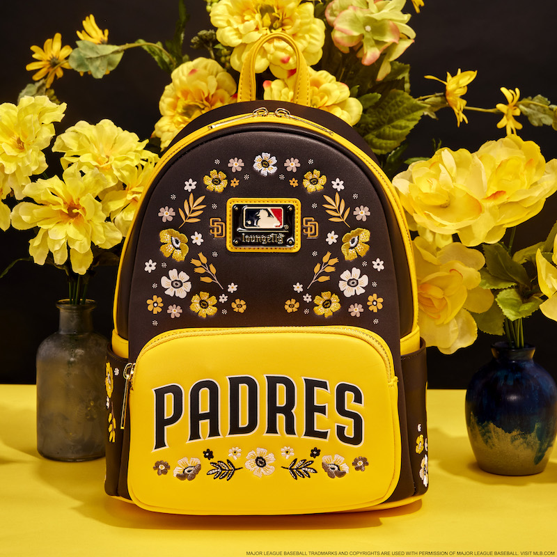 Brown and yellow floral Loungefly San Diego Padres mini backpack against a yellow and dark brown background and surrounded by yellow flowers